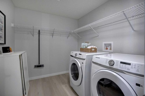409-245 Edith Place Nw, Calgary, AB - Indoor Photo Showing Laundry Room