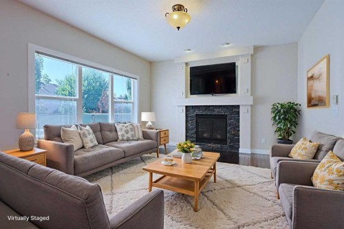 55 Tuscany Estates Drive Nw, Calgary, AB - Indoor Photo Showing Living Room With Fireplace