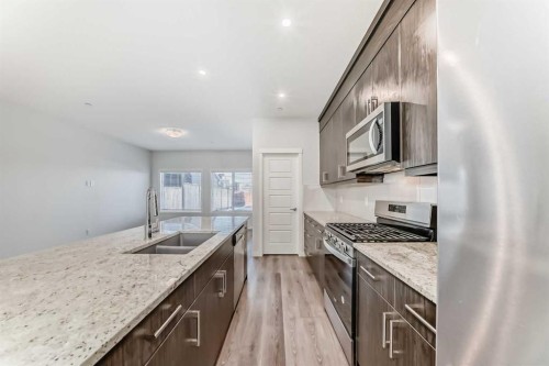 272 Livingston View Nw, Calgary, AB - Indoor Photo Showing Kitchen With Double Sink With Upgraded Kitchen