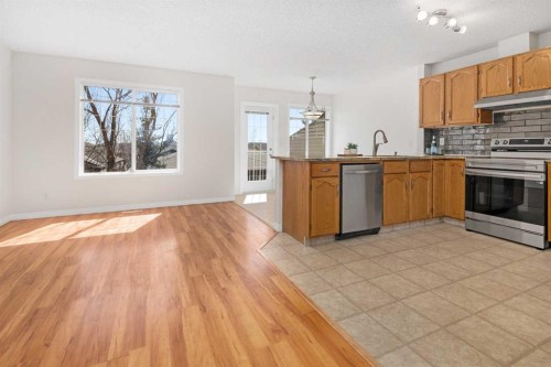 108 Hidden Creek Rise Nw, Calgary, AB - Indoor Photo Showing Kitchen With Double Sink