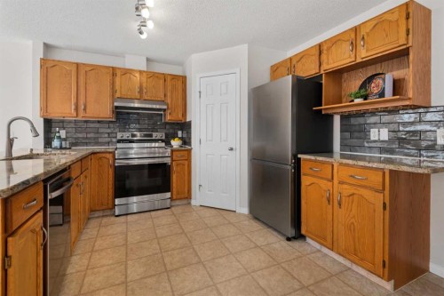 108 Hidden Creek Rise Nw, Calgary, AB - Indoor Photo Showing Kitchen With Stainless Steel Kitchen
