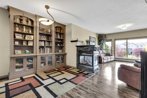 943 Bayside Drive Sw, Airdrie, AB - Indoor With Fireplace