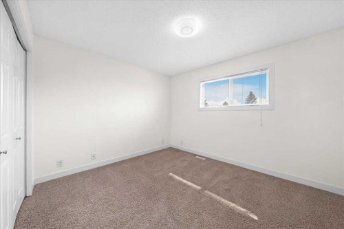 61 Falmere Way Ne, Calgary, AB - Indoor Photo Showing Other Room