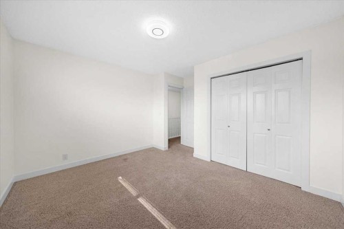 61 Falmere Way Ne, Calgary, AB - Indoor Photo Showing Other Room