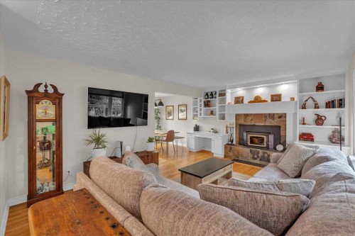 85 Warwick Drive Sw, Calgary, AB - Indoor Photo Showing Living Room With Fireplace