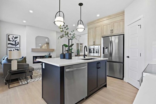 64 Fireside Common, Cochrane, AB - Indoor Photo Showing Kitchen With Upgraded Kitchen