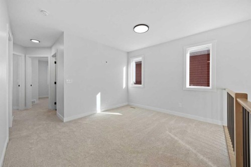 64 Fireside Common, Cochrane, AB - Indoor Photo Showing Other Room