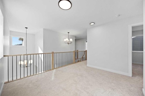 64 Fireside Common, Cochrane, AB - Indoor Photo Showing Other Room