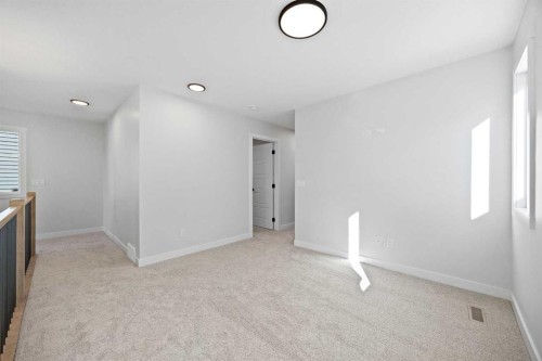 64 Fireside Common, Cochrane, AB - Indoor Photo Showing Other Room