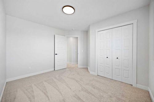 64 Fireside Common, Cochrane, AB - Indoor Photo Showing Other Room