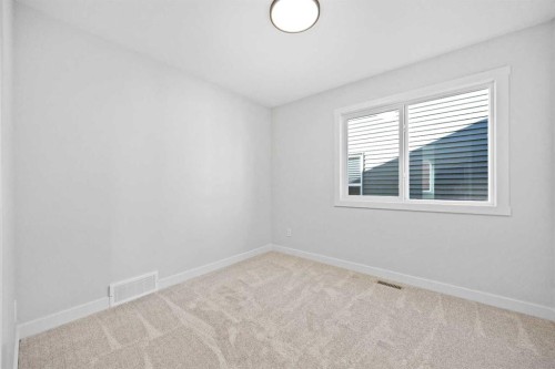 64 Fireside Common, Cochrane, AB - Indoor Photo Showing Other Room