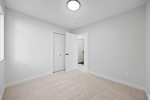 64 Fireside Common, Cochrane, AB - Indoor Photo Showing Other Room