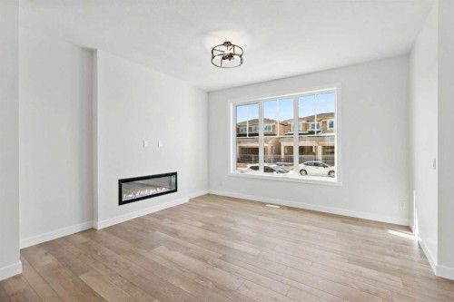 414 River Avenue, Cochrane, AB - Indoor Photo Showing Living Room With Fireplace