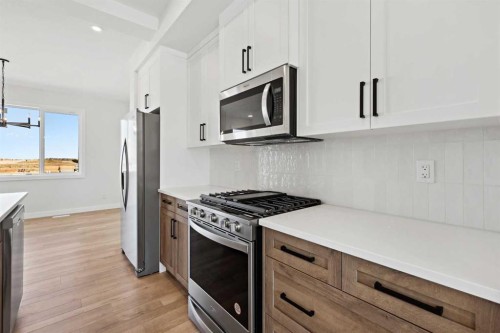 414 River Avenue, Cochrane, AB - Indoor Photo Showing Kitchen With Stainless Steel Kitchen With Upgraded Kitchen