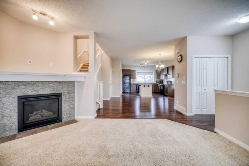37 Panton View Nw, Calgary, AB - Indoor Photo Showing Living Room With Fireplace