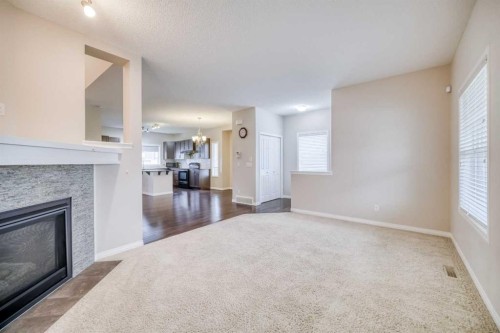 37 Panton View Nw, Calgary, AB - Indoor Photo Showing Other Room With Fireplace