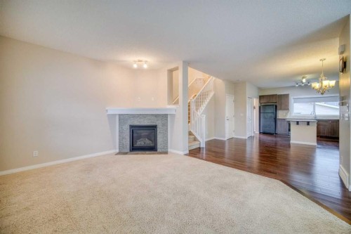 37 Panton View Nw, Calgary, AB - Indoor Photo Showing Living Room With Fireplace