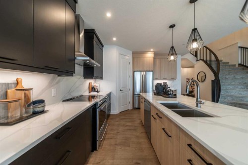 203 Lucas Common Nw, Calgary, AB - Indoor Photo Showing Kitchen With Double Sink With Upgraded Kitchen
