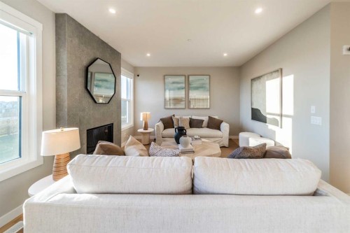 207 Lucas Common Nw, Calgary, AB - Indoor Photo Showing Living Room With Fireplace