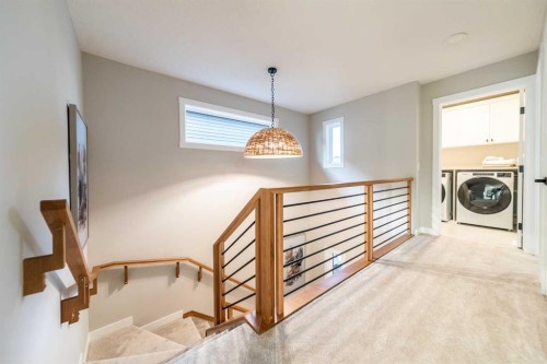 207 Lucas Common Nw, Calgary, AB - Indoor Photo Showing Laundry Room