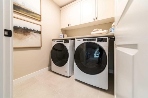 207 Lucas Common Nw, Calgary, AB - Indoor Photo Showing Laundry Room