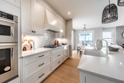 207 Lucas Common Nw, Calgary, AB - Indoor Photo Showing Kitchen With Upgraded Kitchen