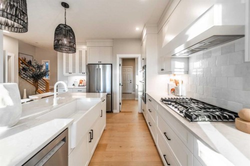 207 Lucas Common Nw, Calgary, AB - Indoor Photo Showing Kitchen With Upgraded Kitchen