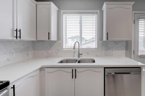134 Hidden Way Nw, Calgary, AB - Indoor Photo Showing Kitchen With Double Sink