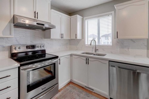 134 Hidden Way Nw, Calgary, AB - Indoor Photo Showing Kitchen With Stainless Steel Kitchen With Double Sink