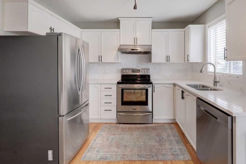 134 Hidden Way Nw, Calgary, AB - Indoor Photo Showing Kitchen With Stainless Steel Kitchen With Double Sink