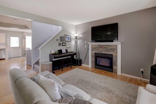 134 Hidden Way Nw, Calgary, AB - Indoor Photo Showing Living Room With Fireplace