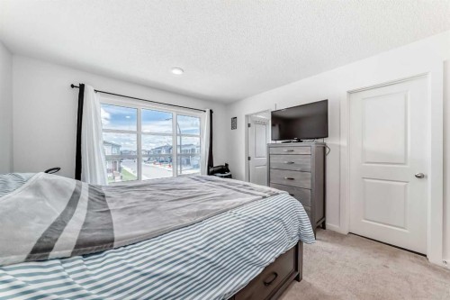 197 Belmont Drive Sw, Calgary, AB - Indoor Photo Showing Bedroom