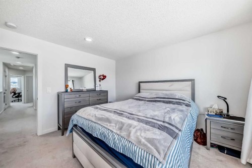 197 Belmont Drive Sw, Calgary, AB - Indoor Photo Showing Bedroom