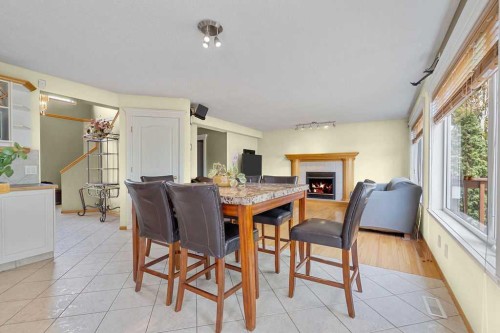 175 Panorama Hills Close Nw, Calgary, AB - Indoor Photo Showing Dining Room With Fireplace