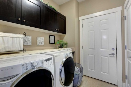 152 Mike Ralph Way Sw, Calgary, AB - Indoor Photo Showing Laundry Room