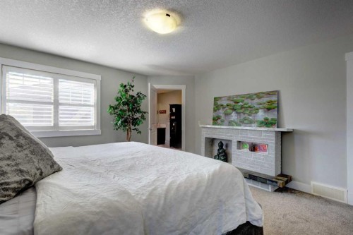 152 Mike Ralph Way Sw, Calgary, AB - Indoor Photo Showing Bedroom