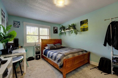 152 Mike Ralph Way Sw, Calgary, AB - Indoor Photo Showing Bedroom