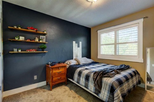 152 Mike Ralph Way Sw, Calgary, AB - Indoor Photo Showing Bedroom