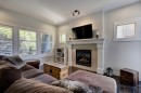 152 Mike Ralph Way Sw, Calgary, AB  - Indoor Photo Showing Living Room With Fireplace 