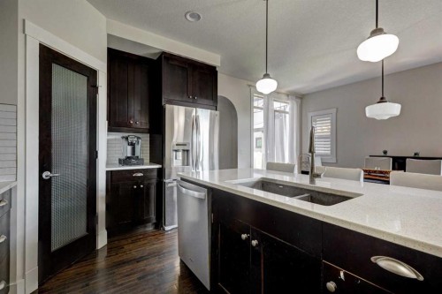 152 Mike Ralph Way Sw, Calgary, AB - Indoor Photo Showing Kitchen With Double Sink