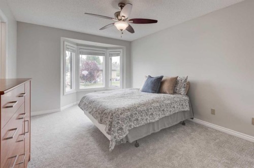 405 2 Avenue Nw, Diamond Valley, AB - Indoor Photo Showing Bedroom