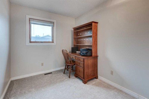 405 2 Avenue Nw, Diamond Valley, AB - Indoor Photo Showing Other Room