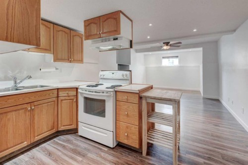 405 2 Avenue Nw, Diamond Valley, AB - Indoor Photo Showing Kitchen With Double Sink
