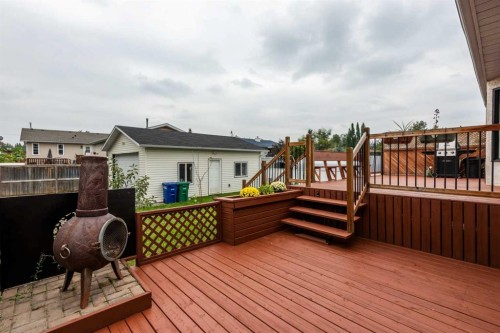 405 2 Avenue Nw, Diamond Valley, AB - Outdoor With Deck Patio Veranda With Exterior