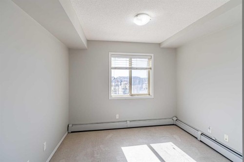 316-5 Saddlestone Way Ne, Calgary, AB - Indoor Photo Showing Other Room