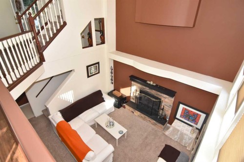 14954 Mt Mckenzie Drive Se, Calgary, AB - Indoor With Fireplace