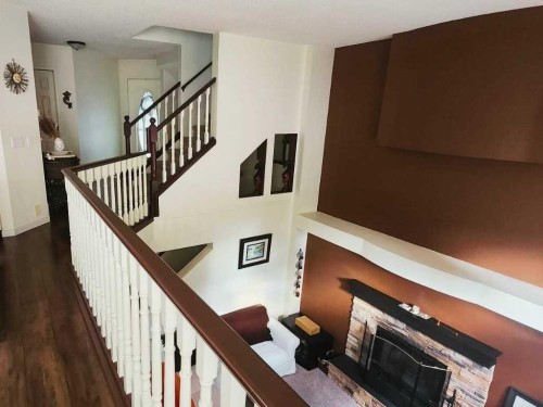 14954 Mt Mckenzie Drive Se, Calgary, AB - Indoor Photo Showing Other Room With Fireplace