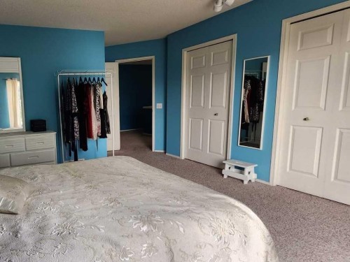 14954 Mt Mckenzie Drive Se, Calgary, AB - Indoor Photo Showing Bedroom