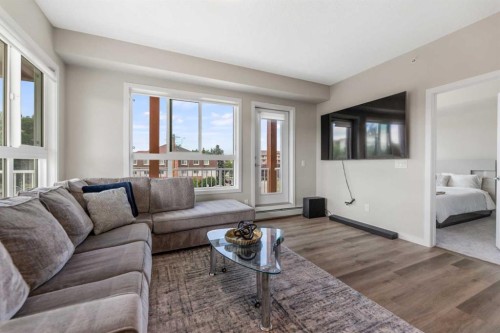 302-1605 17 Street Se, Calgary, AB - Indoor Photo Showing Living Room