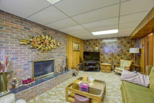 307 Silverthorn Way Nw, Calgary, AB - Indoor Photo Showing Living Room With Fireplace